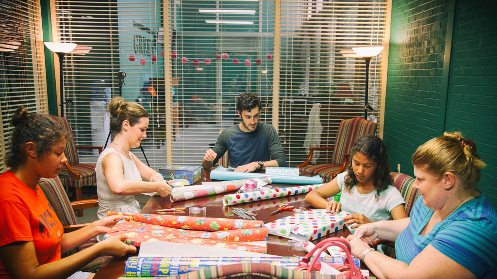 Volunteers wrapping presents